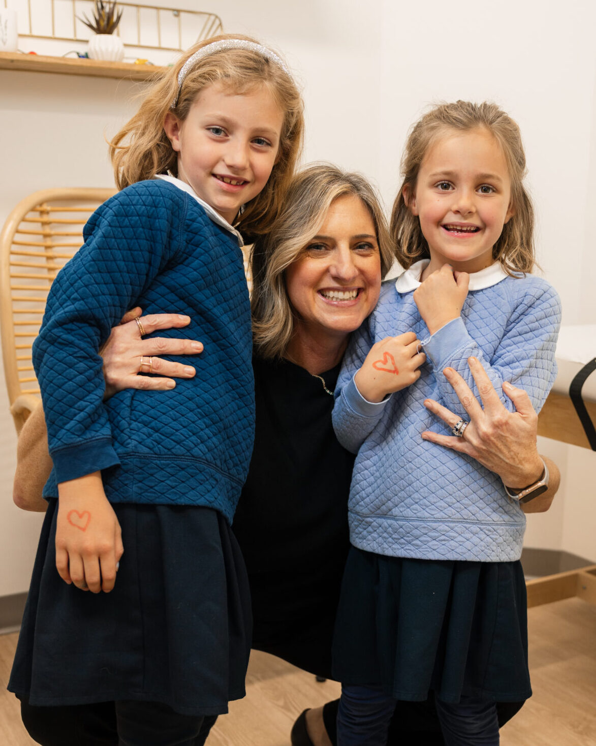Dr. Beth Galla with two of her patients at Sweetbay Pediatrics